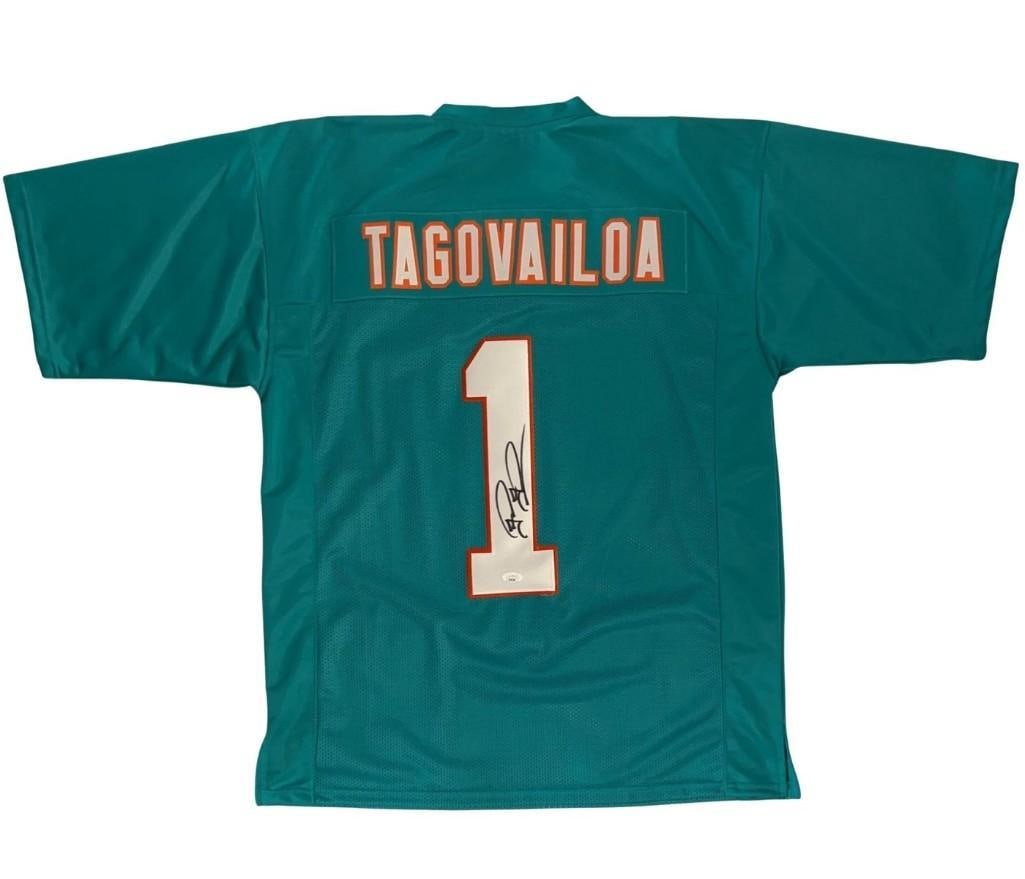 Tua Tagovailoa Signed Miami Dolphins #1 Jersey (JSA Authentication): Blue 33.25" x 24.5" Miami Dolphins jersey #1 signed on the back numbering in black felt tip marker by former Miami player Tua Tagovailoa. In fine condition. Accompanied by a JSA COA (#AE64508).