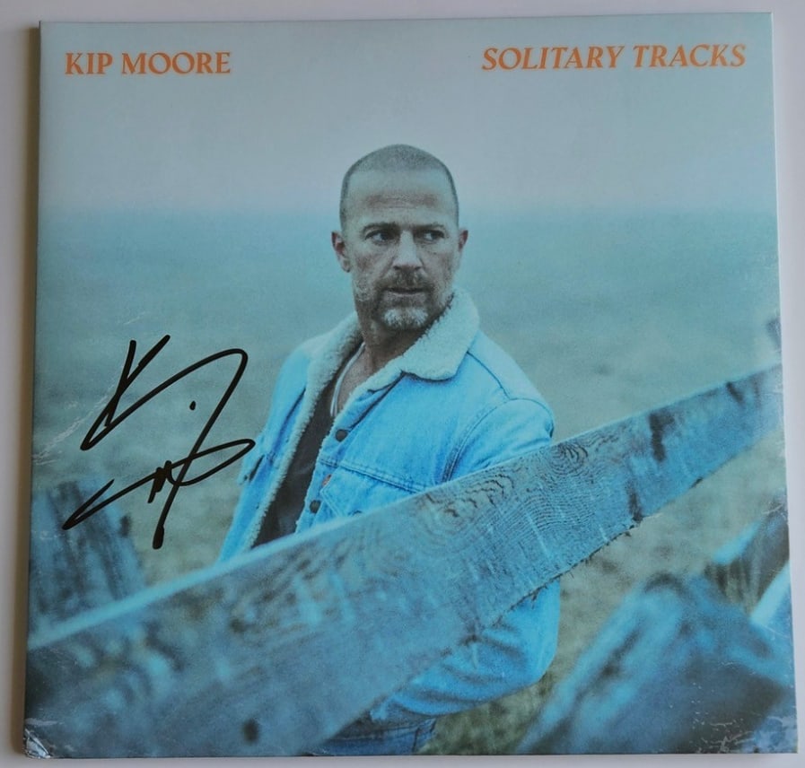 Kip Moore Signed "Solitary Tracks" Album (Third Party Guaranteed): "Solitary Tracks" album signed on the cover in black felt tip marker by musician Kip Moore. Measuring approximately 12" x 12" and in fine condition. Record is included. Provenance Eaton & Brennan