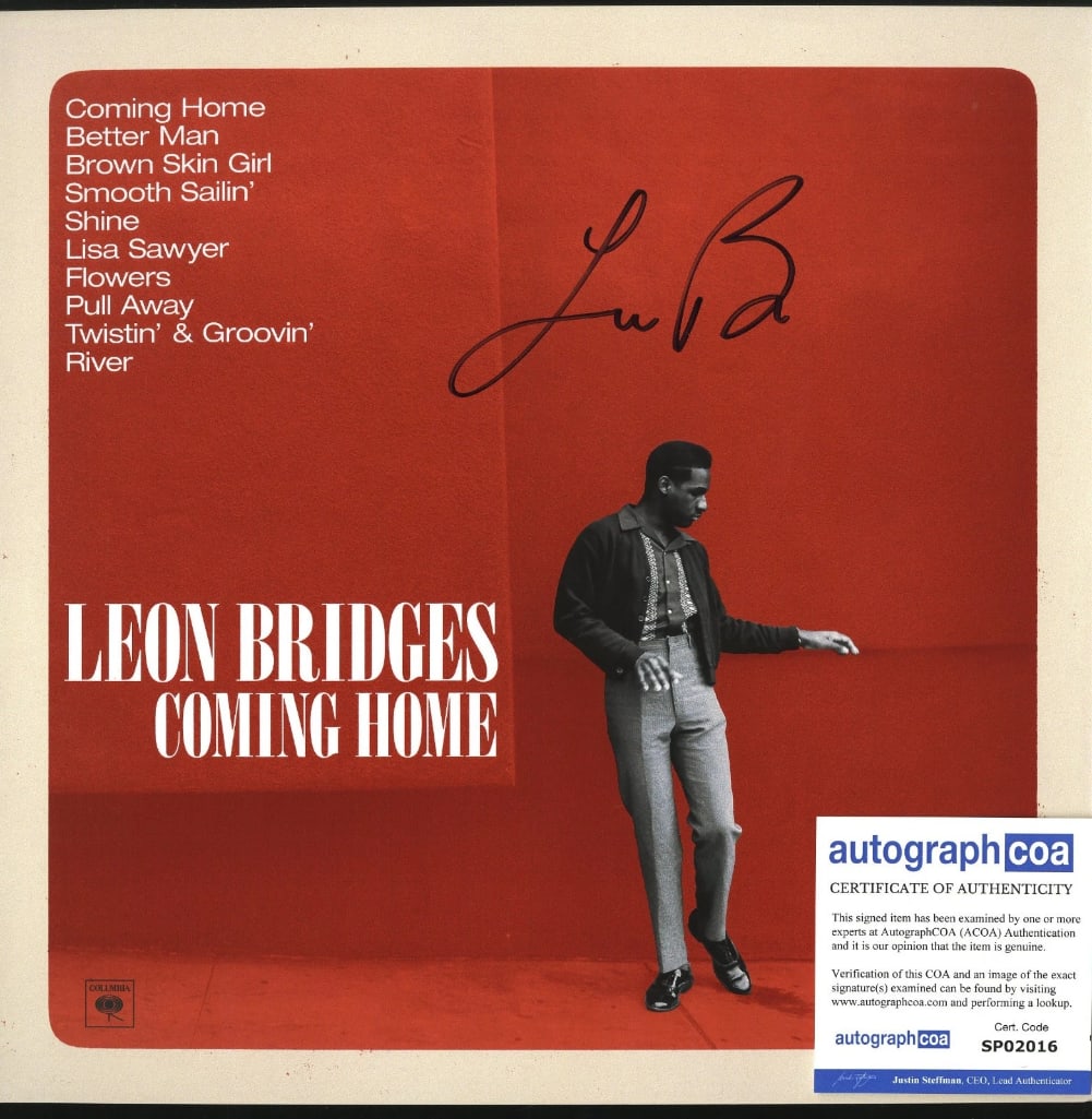 Leon Bridges Signed "Coming Home" Album Flat (ACOA Authentication): "Coming Home" album flat signed in black felt tip marker by musician Leon Bridges. Measuring approximately 12" x 12" and in fine condition. Accompanied by an ACOA COA (#SP02016).