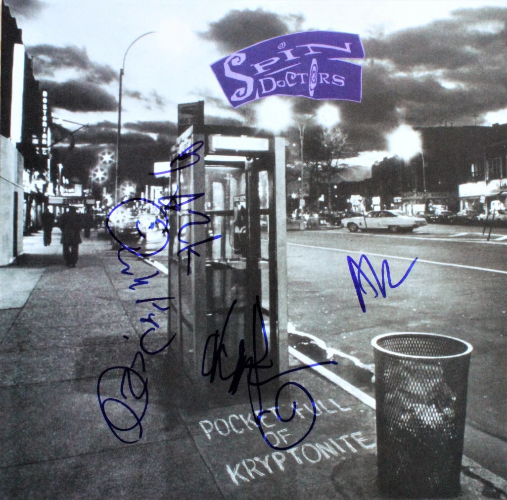 Spin Doctors Group Signed "Pocket Full of Kryptonite" Album (4 Sigs) (ACOA): "Pocket Full of Kryptonite" album signed on the cover in blue felt tip marker by Spin Doctors band members Mark White, Chris Barron, Eric Schenkman, and Aaron Comess. Measuring approximately 12" x 12"