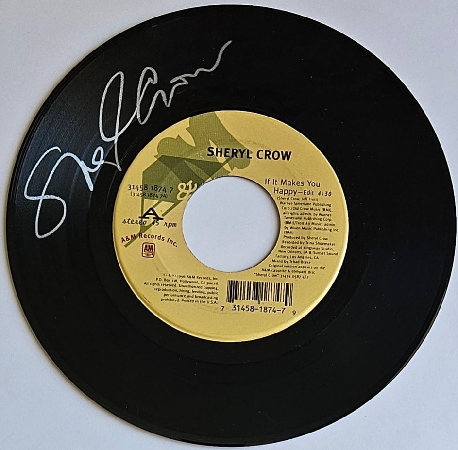 Sheryl Crow Signed "If It Makes You Happy" 45 (Third Party Guaranteed): "If It Makes You Happy" 45 signed on the record disc front in silver felt tip marker by musician Sheryl Crow. Measuring approximately 7" x 7" and in fine condition. Provenance Eaton & Brennan