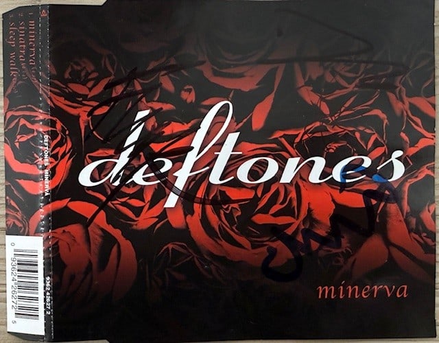 Deftones Group Signed "Minerva" CD (4 Sigs) (Third Party Guaranteed): "Minerva" CD signed on the cover in black felt tip marker by Deftones band members Chino Moreno, Chi Cheng, Frank Delgado, and Stephen Carpenter. Measuring approximately 5" x 5" and in fine condition.