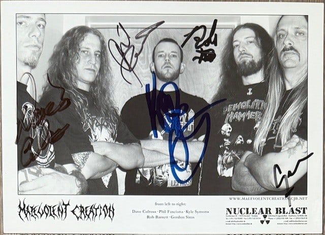 Malevolent Creation Fully Signed 6" x 8.5" Promo Photo (5 Sigs) (Third Party Guaranteed): Black-and-white 6" x 8.5" promotional photo signed in black and blue felt tip marker by Malevolent Creation band members Deron Miller, Phil Fasciana, Ron Parmer, Jesse Jolly, and Chris Cannella. In fi