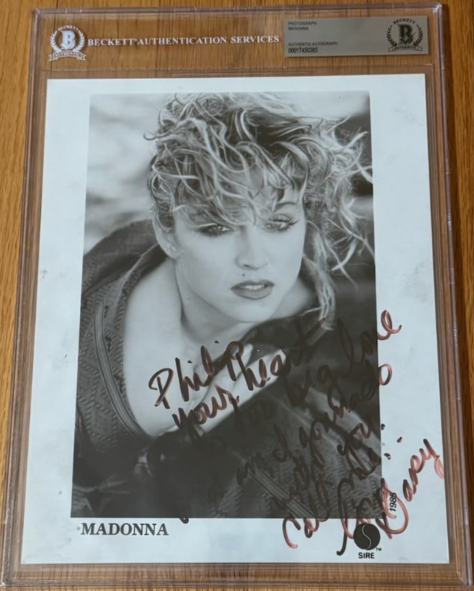 Madonna Vintage 1985 Signed 10" x 8" Sire Records Promo Photo (Beckett Encapsulated): Rare black-and-white 10" x 8" original 1985 Sire Records promotional photo signed in black felt tip marker by Madonna, who additionally inscribed, “Philip, your heart is too big love, what am I 