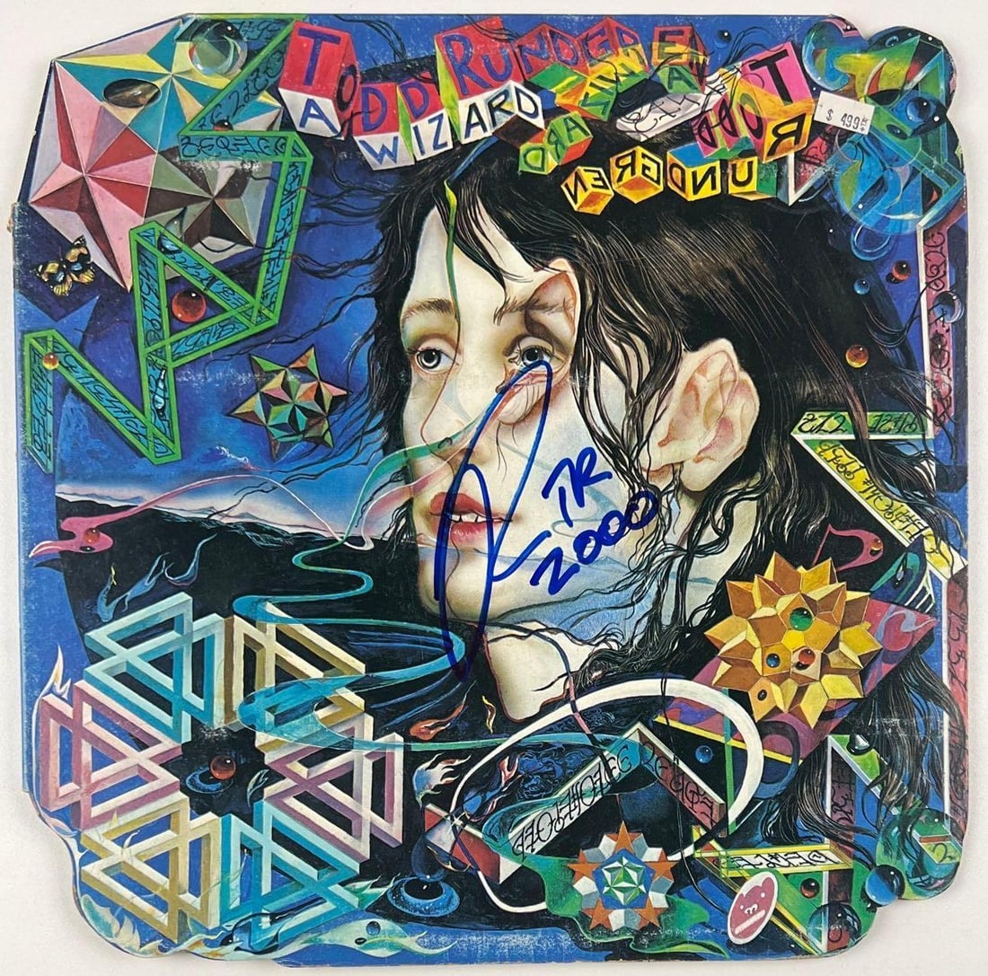 Todd Rundgren Signed "A Wizard, a True Star" Album (Beckett): "A Wizard, a True Star" album signed on the cover in blue felt tip marker by musician Todd Rundgren. Measuring approximately 12" x 12" and in fine condition. Accompanied by a Beckett COA (#BC64727).