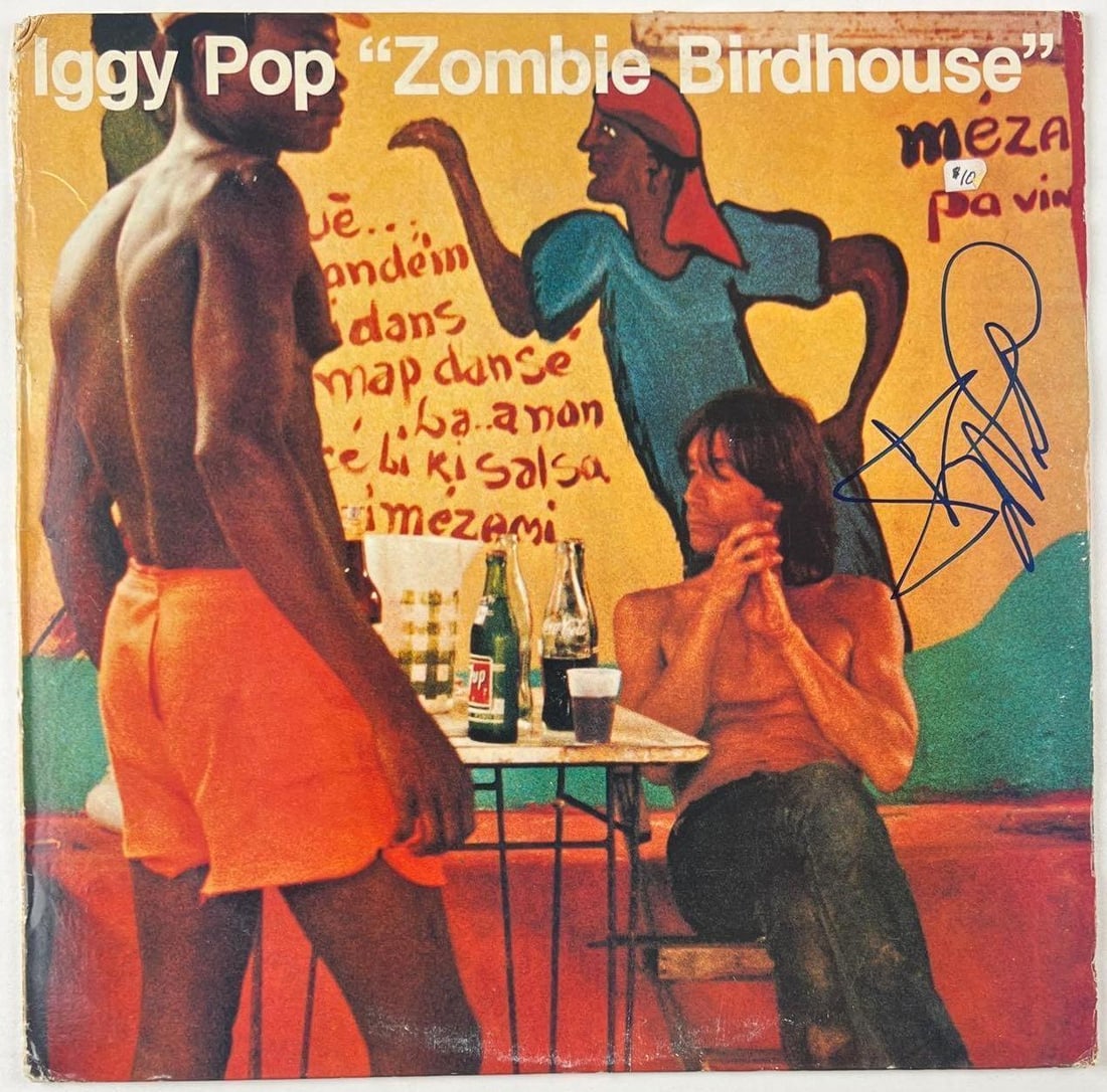Iggy Pop Signed "Zombie Birdhouse" Album (Beckett Authentication): "Zombie Birdhouse" album signed on the cover in blue felt tip marker by musician Iggy Pop. Measuring approximately 12" x 12" and in fine condition. Record is included. Obtained in-person. Accompanied