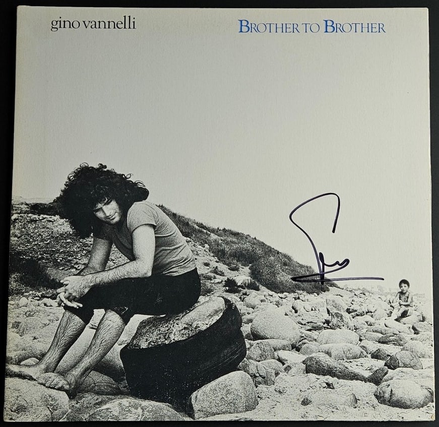 Gino Vannelli Signed "Brother to Brother" Album (Third Party Guaranteed): "Brother to Brother" album signed on the cover in black felt tip marker by musician Gino Vannelli. Measuring approximately 12" x 12" and in fine condition. Record is included. Provenance Eaton & Brenn
