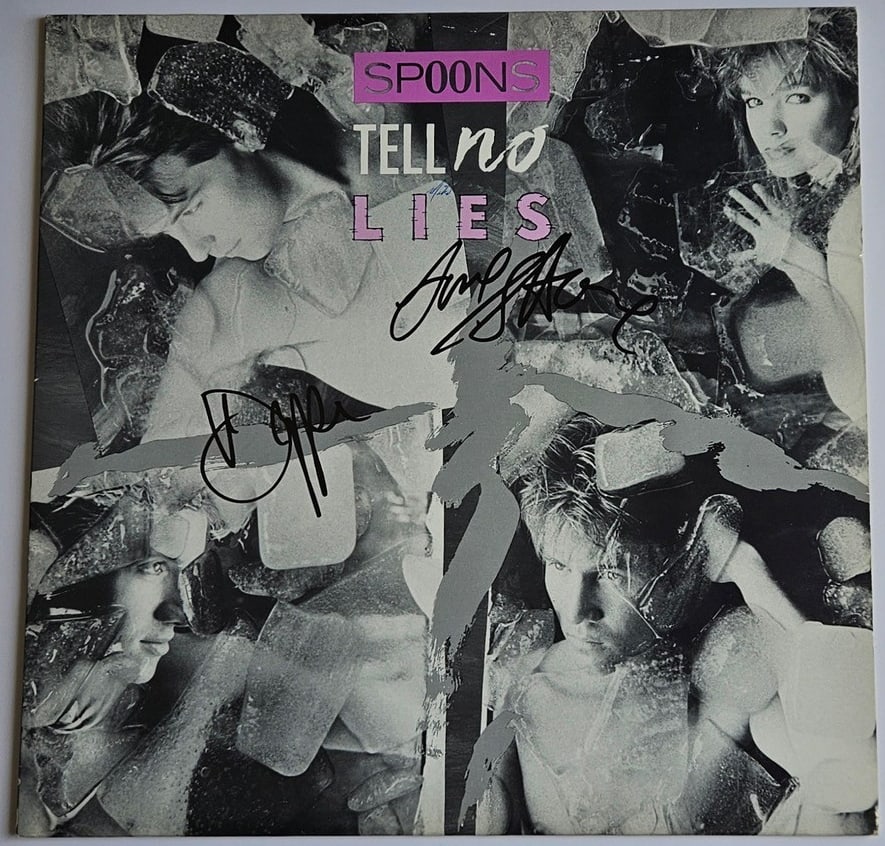 Spoons: Gordon Deppe & Sandy Horne Signed "Tell No Lies" Album (2 Sigs) (Third Party Guaranteed): "Tell No Lies" album signed on the cover in black felt tip marker by Spoons band members Gordon Deppe and Sandy Horne. Measuring approximately 12" x 12" and in fine condition. Record is included. Prov