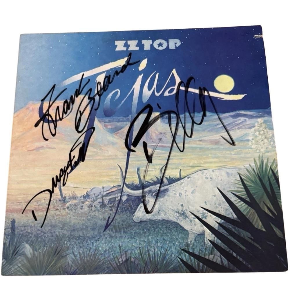 ZZ Top Group Signed "Tejas" Album (3 Sigs) (Beckett Authentication): "Tejas" album signed on the cover in black felt tip marker by ZZ Top band members Billy Gibbons, Dusty Hill, and Frank Beard. Measuring approximately 12" x 12" and in fine condition. Record is include