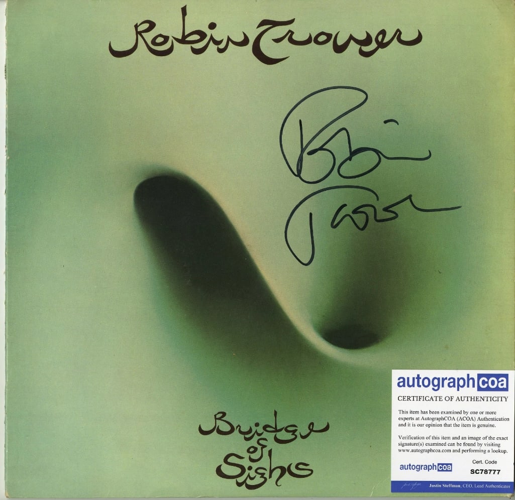 Robin Trower Signed "Bridge of Sighs" Album (ACOA Authentication): "Bridge of Sighs" album signed on the cover in black felt tip marker by musician Robin Trower. Measuring approximately 12" x 12" and in fine condition. Accompanied by an ACOA COA (#SC78777).