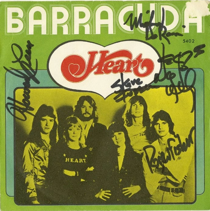 Heart Group Signed "Barracuda" 45 (4 Sigs) (ACOA Authentication): "Barracuda" 45 signed on the cover in black felt tip marker by Heart band members Nancy Wilson, Steve Fossen, Mike Inez, and Roger Fisher. Measuring approximately 7" x 7" and in fine condition. Accomp