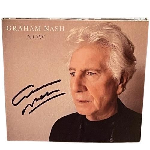 Crosby, Stills & Nash: Graham Nash Signed "Now" CD (JSA): "Now" CD signed on the cover in black felt tip marker by musician Graham Nash. Measuring approximately 5" x 5" and in fine condition. Accompanied by a JSA COA (#AQ96208).