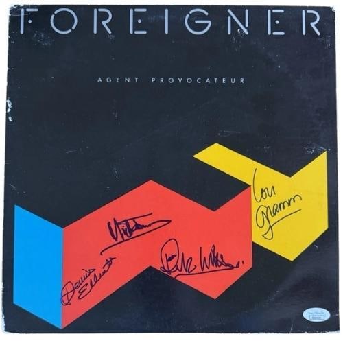 Foreigner Group Signed "Agent Provocateur" Album (4 Sigs) (JSA Authentication): "Agent Provocateur" album signed on the cover in blue felt tip marker by Foreigner band members Lou Gramm, Mick Jones, Rick Wills, and Dennis Elliott. Measuring approximately 12" x 12" and in very goo