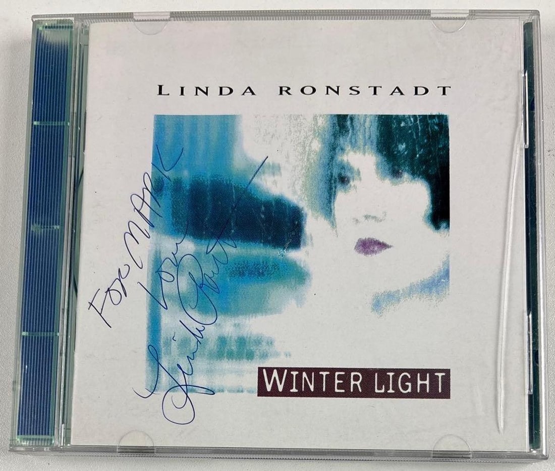 Linda Ronstadt Signed "Winter Light" CD (Third Party Guaranteed): "Winter Light" CD signed on the cover in black ballpoint pen by musician Linda Ronstadt, who also inscribed "For Mark and Lisa" before her signature. Measuring approximately 5" x 5" and in fine condit