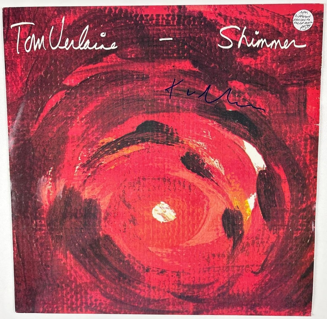 Television: Tom Verlaine Signed "Shimmer" Album (Beckett Authentication): "Shimmer" album signed on the cover in blue felt tip marker by Television band member Tom Verlaine. Measuring approximately 12" x 12" and in fine condition. Record is included. Obtained in-person.