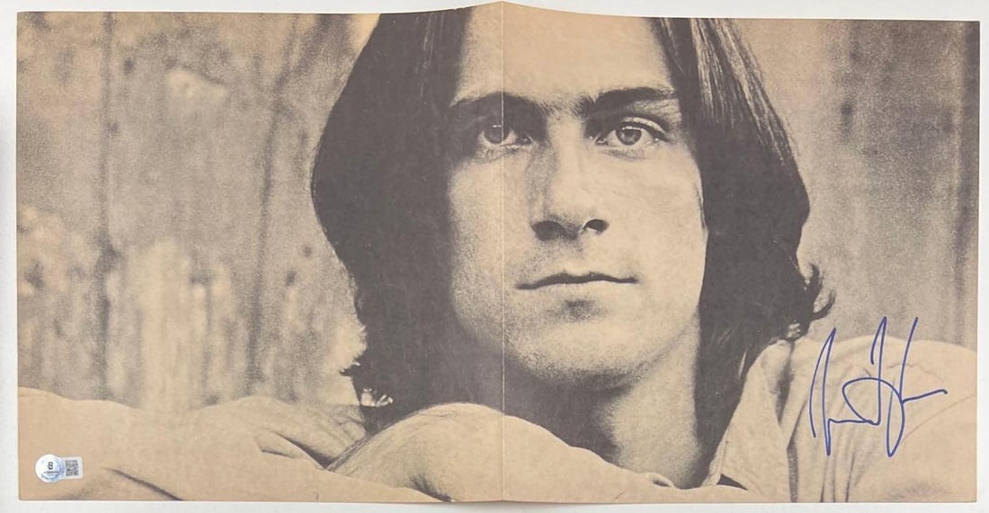 James Taylor Signed "Sweet Baby James" Album Lyric Insert Fold-Out (Beckett Authentication): "Sweet Baby James" album signed on the lyric insert fold-out in blue felt tip marker by musician James Taylor. Unfolded, the lyric insert measures approximately 11" x 22," and is in fine condition.