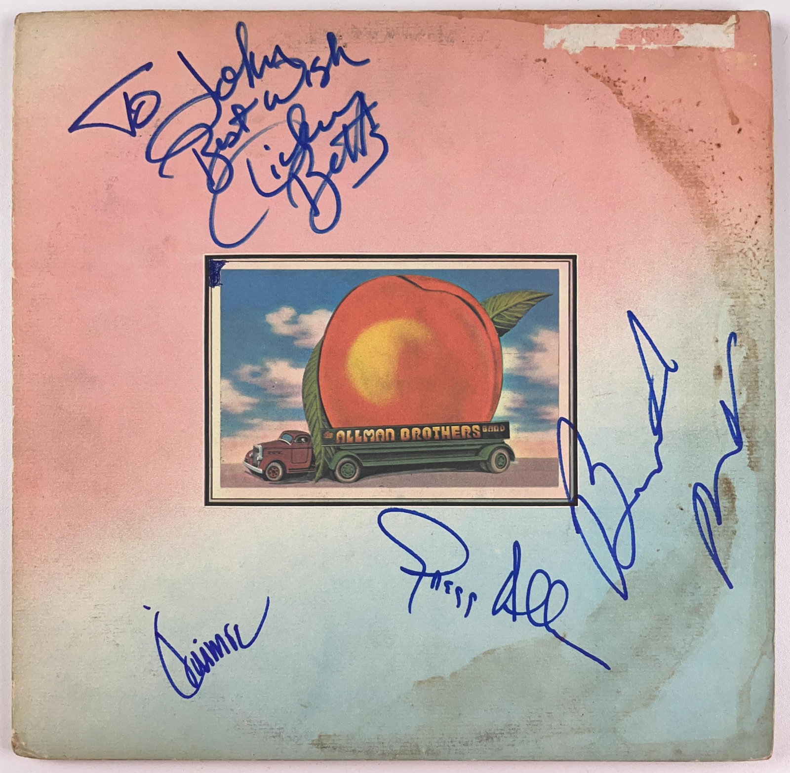 The Allman Brothers Band Group Signed "Eat a Peach" Album (4 Sigs) (Beckett Authentication): "Eat a Peach" album signed on the cover in blue felt tip markers by The Band band members Greg Allman, Jaimoe Johanson, Butch Trucks, and Dickey Betts who inscribed "To John best wishes" before his si