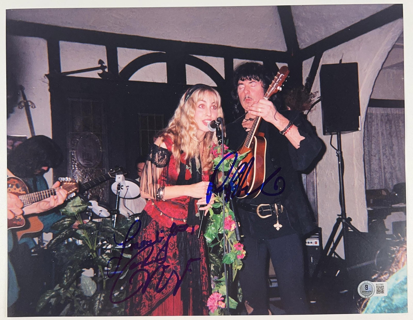 Deep Purple: Ritchie Blackmore & Candice Night Signed 11 x 14 Photo (Beckett): Color 11" x 14" photo signed in blue felt tip marker by Deep Purple band member Ritchie Blackmore and his wife Candice Night. In fine condition. Authenticated by Beckett, with their official hologram