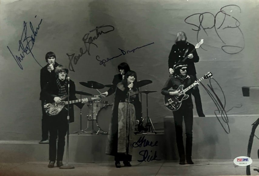 Jefferson Airplane Fully Group Signed 11" x 14" Photo (6 Sigs) (PSA/DNA Authentication): Black-and-white 11" x 14" photo signed in black and blue felt tip markers by Jefferson Airplane band members Grace Slick, Jorma Kaukonen, Jack Casady, Paul Kantner, Marty Balin, and Spencer Dryden. In