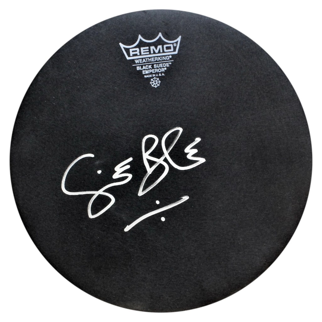 Cream: Ginger Baker Signed 10" Remo Drumhead (ACOA Authentication): Black 10" Remo brand drumhead signed on the front in silver felt tip marker by Cream band member Ginger Baker. In fine condition. Accompanied by a full Letter of Authenticity from ACOA (#SA68472).