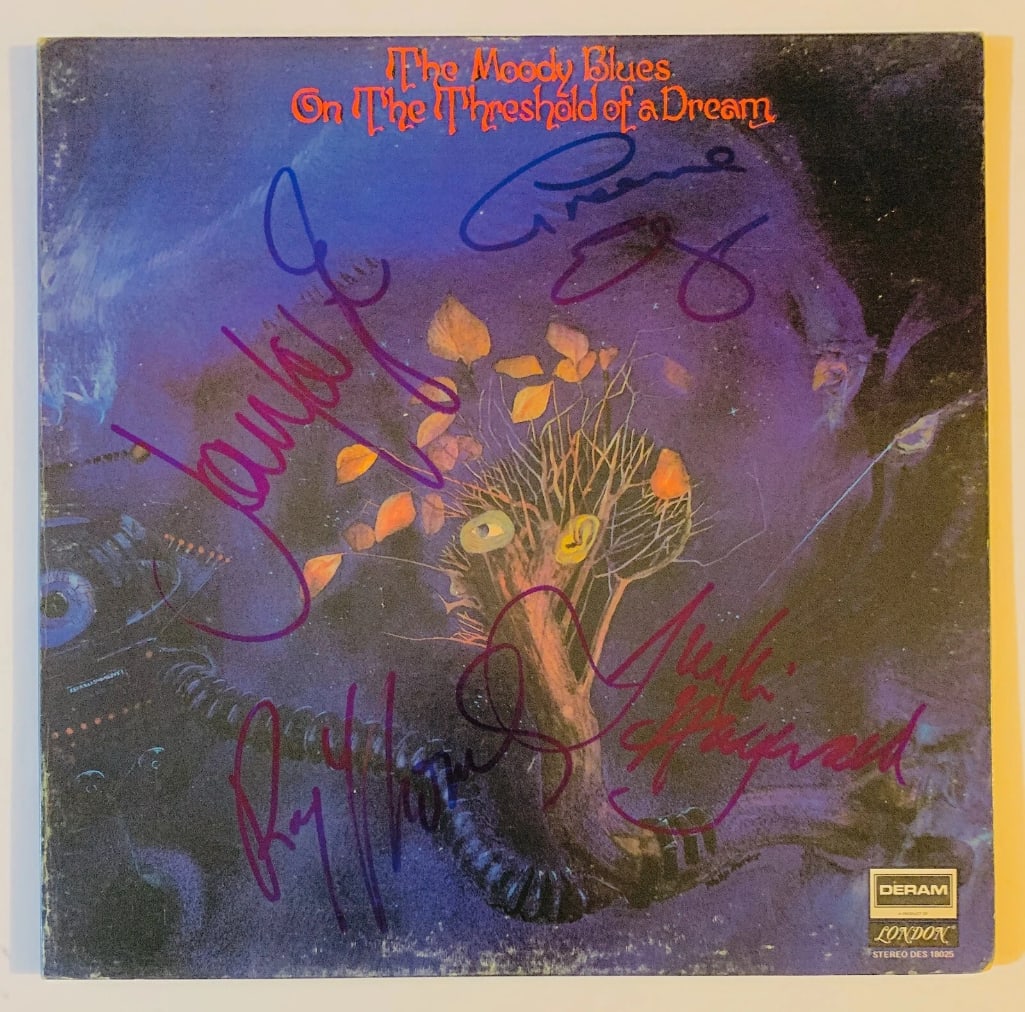 Moody Blues Group Signed "On a Threshold of a Dream" LP Album (4 Sigs) (JSA Authentication): "On a Threshold of a Dream" LP album signed on the cover in blue felt tip marker by Moody Blues band members Justin Hayward, John Lodge, Graeme Edge, and Ray Thomas. Record is included. Obtained in-pe