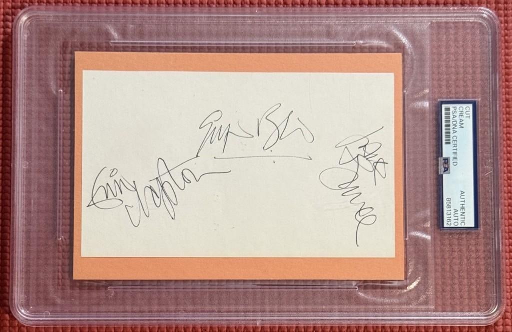 Cream Group Signed 5" x 7" Cut (3 Sigs) (PSA/DNA Encapsualted): Stunning and crisp white 5" x 7" cut signed in black ballpoint pen by Cream band members Ginger Baker, Jack Bruce, and Eric Clapton. In fine condition. Encapsulated and authenticated by PSA/DNA (#8581