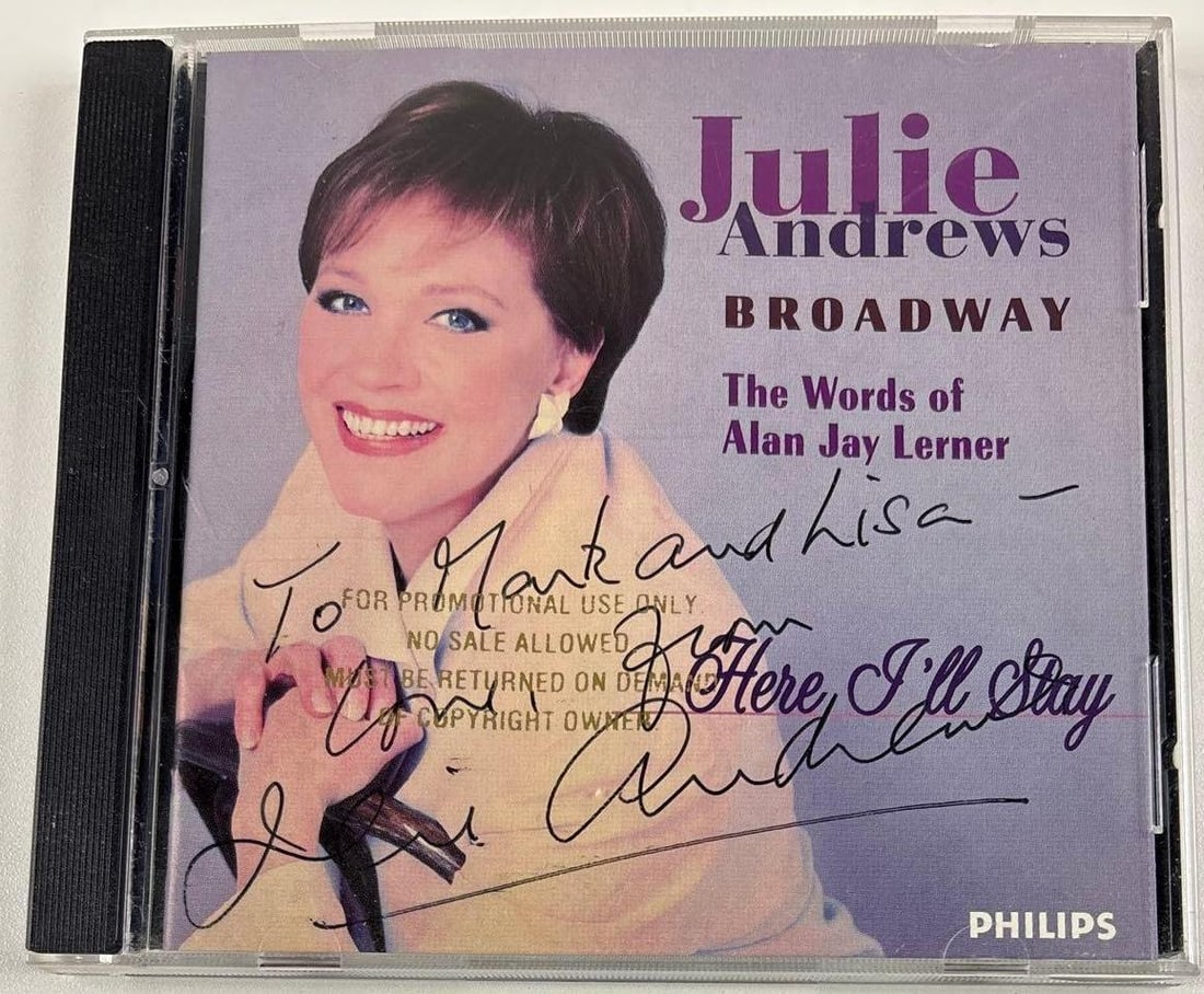 Julie Andrews Signed "Julie Andrews Broadway" CD (Third Party Guaranteed): "Julie Andrews Broadway" CD signed on the cover in black ballpoint pen by actress Julie Andrews, who also inscribed "To Mark and Lisa" before her signature. Measuring approximately 5" x 5" and in fine