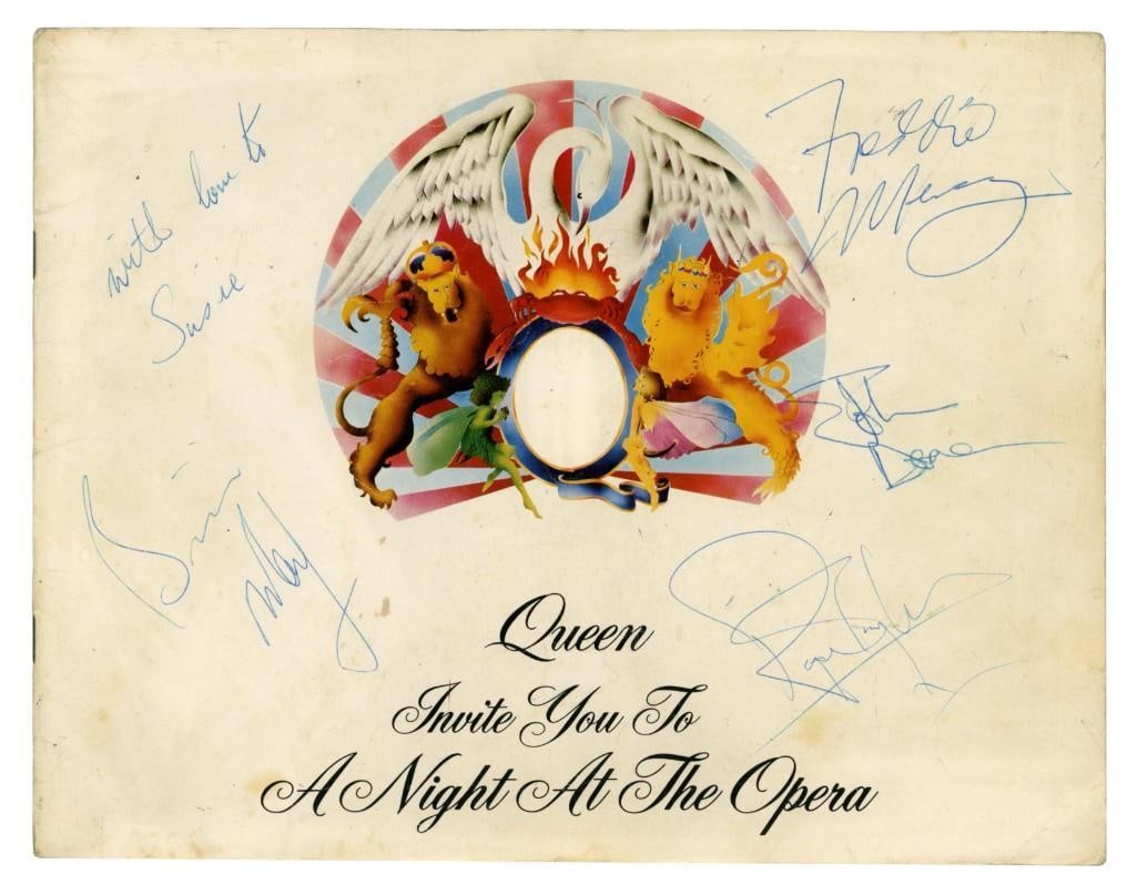 Queen Vintage Fully Group Signed 1975 "Night at the Opera" Concert Program (4 Sigs) (Tracks COA): Landmark Queen 1975 "A Night at the Opera" concert program signed on the front cover in blue ballpoint pen by band members Freddie Mercury, Brian May, John Deacon, and Roger Taylor. Brian May has addi