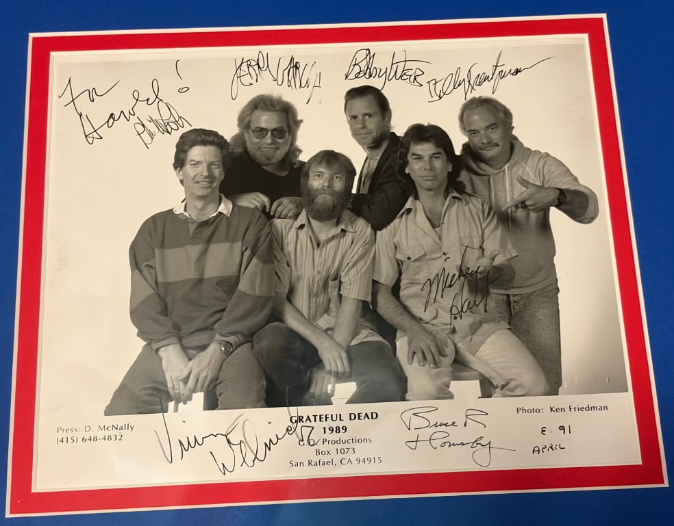 Grateful Dead Fully Group Signed 8" x 10" Press Photo Framed (7 Sigs) (JSA): Fantastic black-and-white 8" x 10" press photo signed in black ink by Grateful Dead members Jerry Garcia, Bob Weir, Phil Lesh, Billy Kreutzmann, Mickey Hart, Vince Welnick, and Bruce Hornsby; one of t