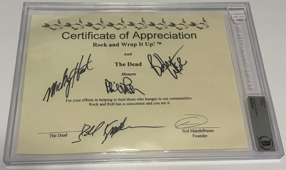 The Grateful Dead Group Signed 8" x 10" Certificate of Appreciation" (4 Sigs) (Beckett Encapsulated): White 8" x 10" "Certificate of Appreciation for Feeding the Hungry" presented to Bob Weir on behalf of Rock and Wrap it Up! signed on the front in black felt tip marker by The Grateful Dead band membe