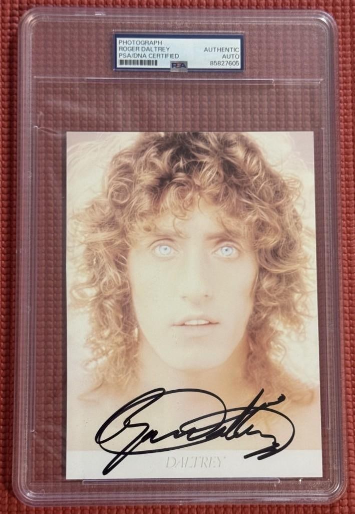 The Who: Roger Daltrey Signed 6.75" x 4.5" Photo (PSA/DNA Encapsulated): Color 6.75" x 4.5" photo signed in black felt tip marker by The Who band member Roger Daltrey. In fine condition. Encapsulated and authenticated by PSA/DNA (#85827605).