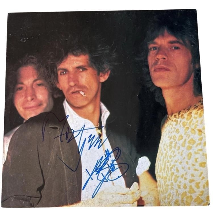 Rolling Stones: Mick Jagger, Keith Richards + 2 Signed 1981 Program Insert (4 Sigs) (Beckett): Attractive color American Tour 81' fold-out program insert, signed on three different 12" x 12" panels by different members or the Rolling Stones—one panel is signed blue felt tip marker by Mick
