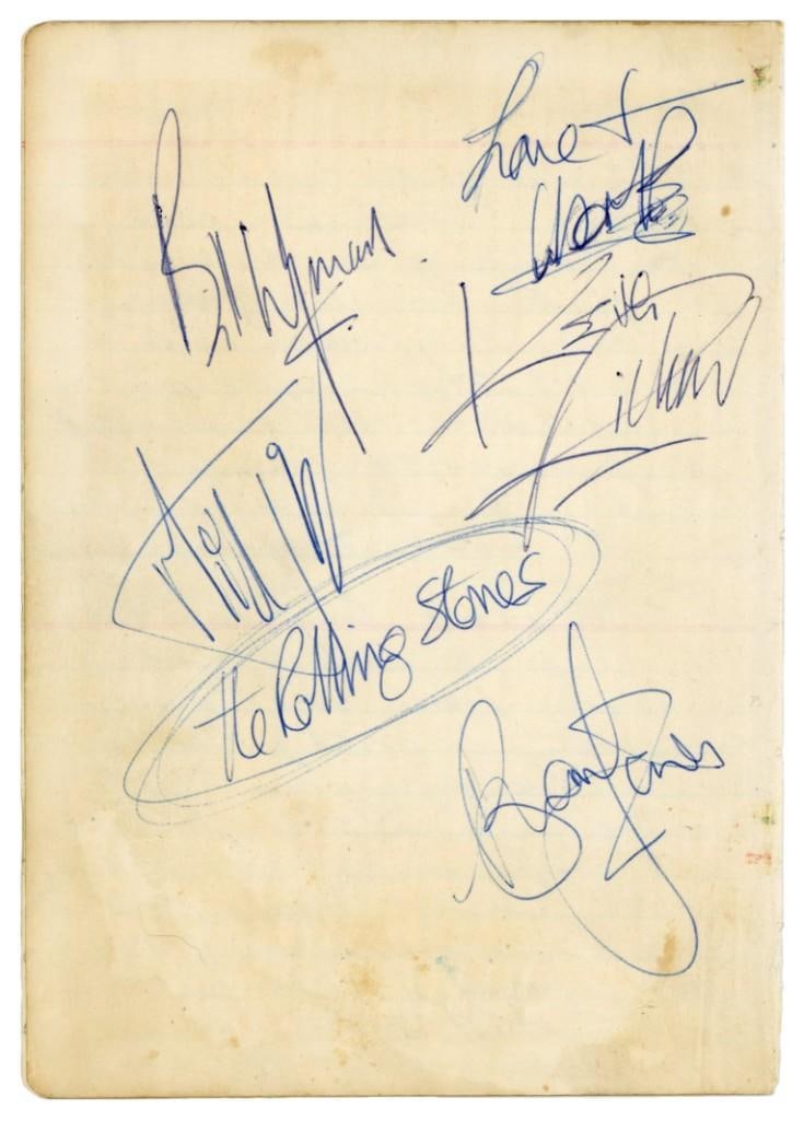The Rolling Stones w/ Brian Jones Vintage Fully Group Signed 1964 Page (5 Sigs) (Tracks COA): Sought-after white diary page, in very good condition with some scattered wear, boldly autographed in blue ballpoint pen by all five original members of The Rolling Stones, including Brian Jones, Mick