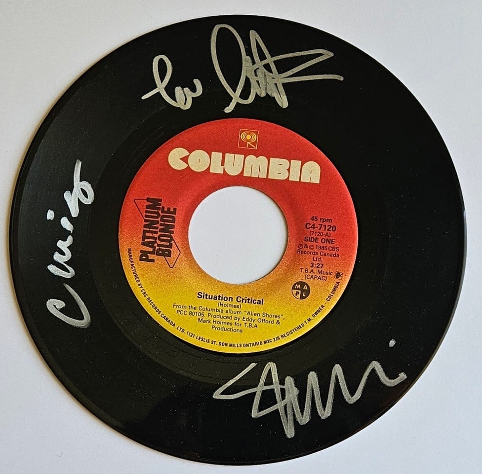 Platinum Blonde Group Signed "Situation Critical" 45 (3 Sigs) (Third Party Guaranteed): "Situation Critical" 45 signed on the record disc front in silver felt tip marker by Platinum Blonde band members Mark Holmes, Sergio Galli, and Chris Steffler. Measuring approximately 7" x 7" and in 