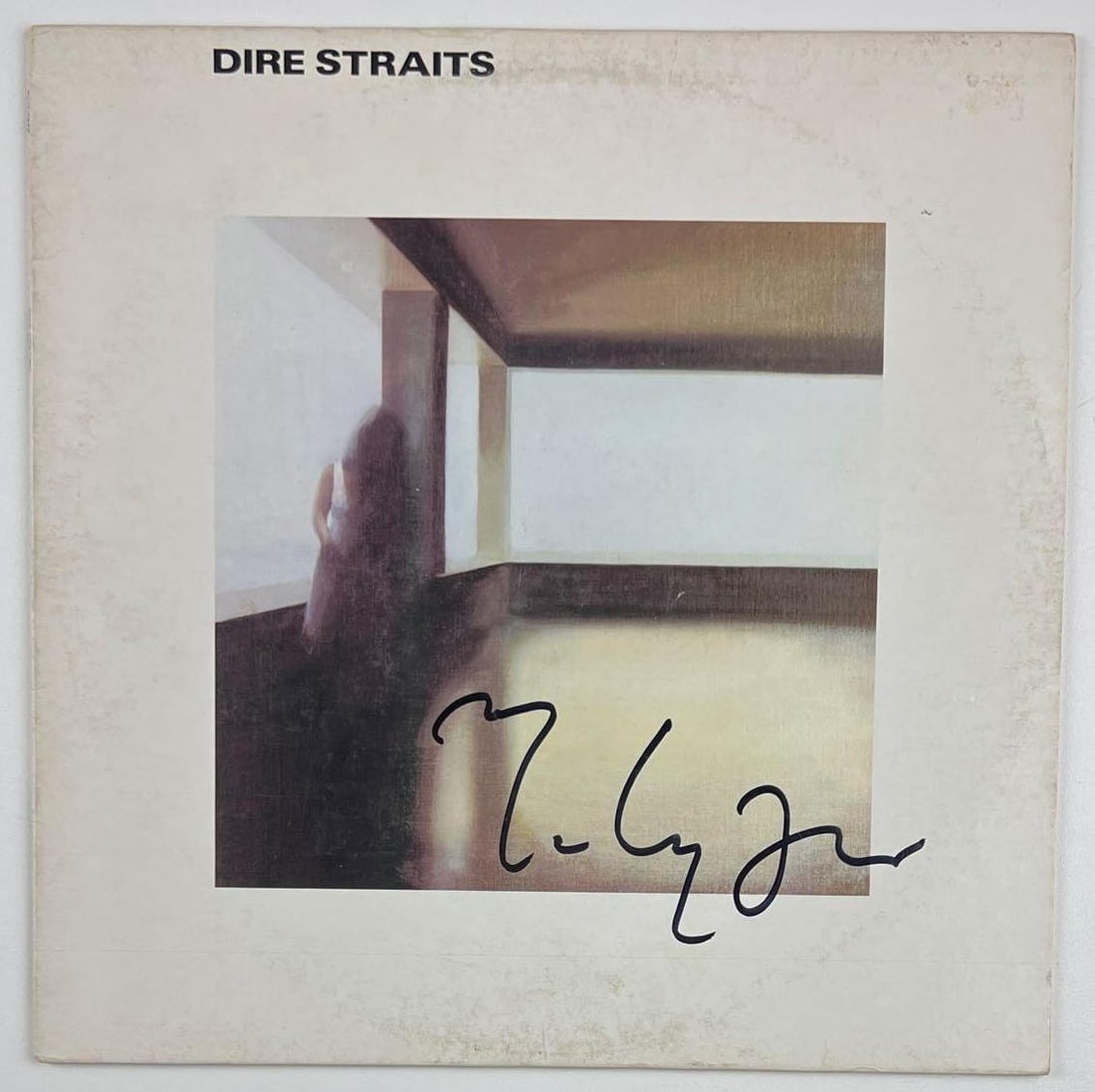 Dire Straits: Marc Knopfler Signed Self-Titled Debut Album (Beckett Authentication): "Dire Straits" album signed on the cover in black felt tip marker by Dire Straits band member Marc Knopfler. Measuring approximately 12" x 12" and in very good condition, with some signs of scattered