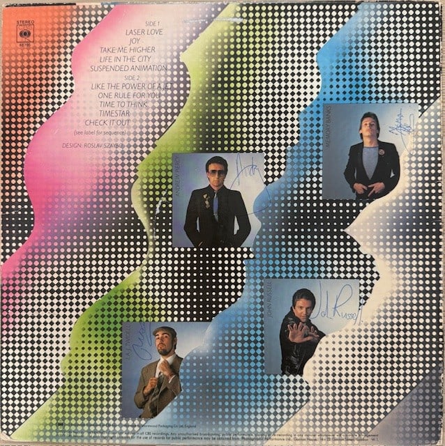 After the Fire Fully Signed "Laser Love" LP Album (4 Sigs) (Third Party Guaranteed): "Laser Love" LP album signed on the back cover in blue ballpoint pen by After the Fire band members Peter 'Memory' Banks, Ivor Twidwell, John Russell, and Andrew Piercy. Measuring approximately 12" x 