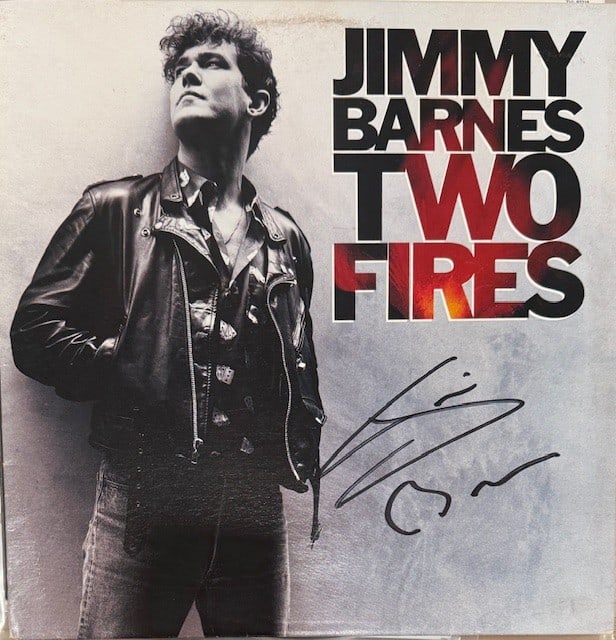 Jimmy Barnes Signed "Two Fires" LP Album (Third Party Guaranteed): "Two Fires" LP album signed on the cover in black felt tip marker by musician Jimmy Barnes. Measuring approximately 12" x 12" and in fine condition. Record is included. Provenance Eaton & Brennan Auct