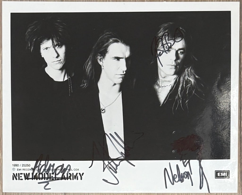 New Model Army Fully Signed 8 x 10 Promo Photo (4 Sigs) (Third Party Guaranteed): Black-and-white 8" x 10" photo signed in black felt tip marker by New Model Army band members Justin Sullivan, Nelson, Robert Heaton, and Adrian Portas. In fine condition. Provenance Eaton & Brennan A