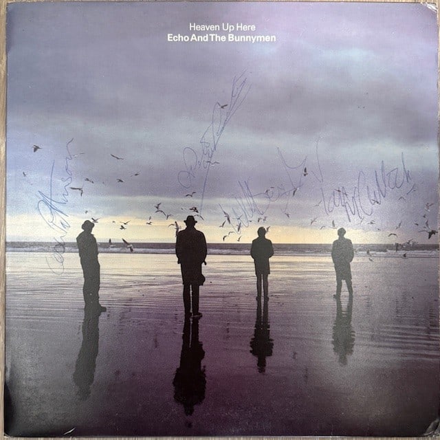 Echo & the Bunnymen Group Signed "Heaven Up Here" LP Album (4 Sigs) (Third Party Guaranteed): "Heaven Up Here" LP album signed on the cover in blue ballpoint pen by Echo & the Bunnymen band members Ian McCulloch, Will Sergeant, Les Pattinson, and Pete de Freitas. Measuring approximately 12" x 