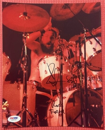 Black Sabbath: Bill Ward Signed 10" x 8" Photo (PSA/DNA Authentication): Color 10" x 8" photo signed in black felt tip marker by Black Sabbath band member Bill Ward, who also inscribed the date "2/23/13" after his signature. In fine condition. Accompanied by a PSA/DNA COA