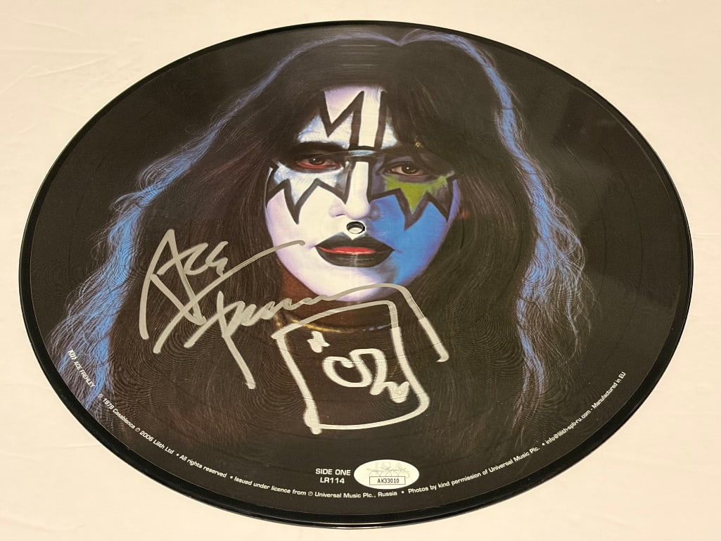 KISS: Ace Frehley Signed Self-Titled Debut Solo Album Picture Disc LP (JSA Authentication): "Ace Frehley" 1978 LP album picture disc signed on the front in blue felt tip marker by KISS band member Ace Frehley. Measuring approximately 12" and in fine condition. Authenticated by JSA, with thei