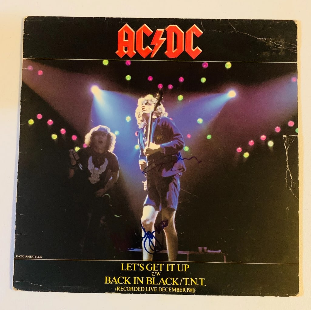 AC/DC Group Signed "Let's Get it Up" LP Album (2 Sigs) (Beckett Authentication): "Let's Get it Up" LP album signed on the cover in blue felt tip marker by AC/DC band members Angus Young, and Malcolm Young. Measuring approximately 12" x 12" and in fine condition. Record is included