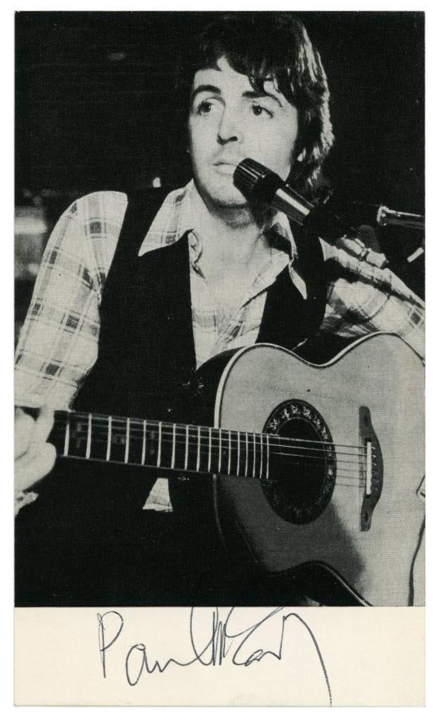 The Beatles: Paul McCartney Vintage 1976 Signed Wings-Era Promo Photo Card (Tracks COA): Attractive black-and-white 6" x 3.5" Wings-era promotional card signed in black ballpoint pen by Paul McCartney. In fine condition. Accompanied by a Tracks COA. The signature dates to 1976. The image