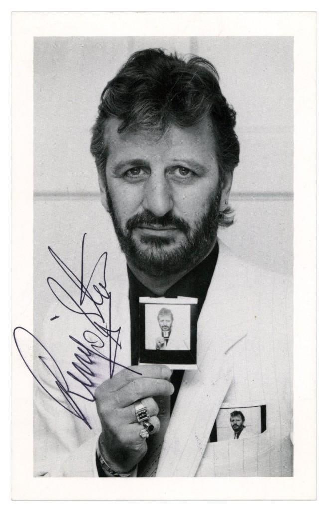 The Beatles: Ringo Starr Signed 5.5" x 3.5" Promo Photo (Tracks COA): Black-and-white 5.5" x 3.5" promotional photo card signed in black ballpoint pen by Ringo Starr. In fine condition. Accompanied by a Tracks COA. The image appears consistent with Starr’s late-19
