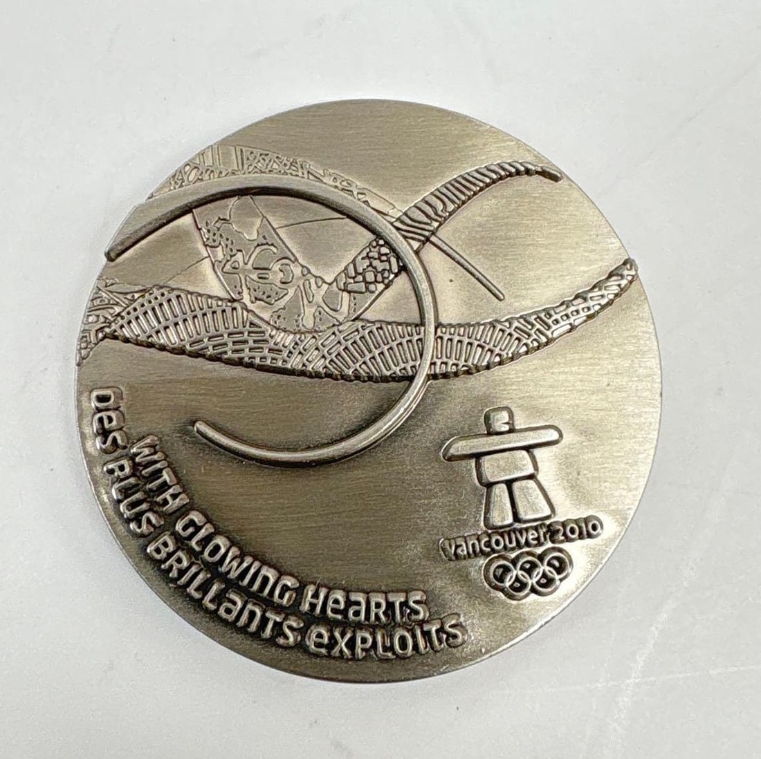Vancouver 2010 Olympic Games Participation Medal: Official 2010 Olympics "With Glowing Hearts" 1.5" x 1.5" participation medal. Medal comes in 3.5" x 3" x 1.5" box. In fine condition.