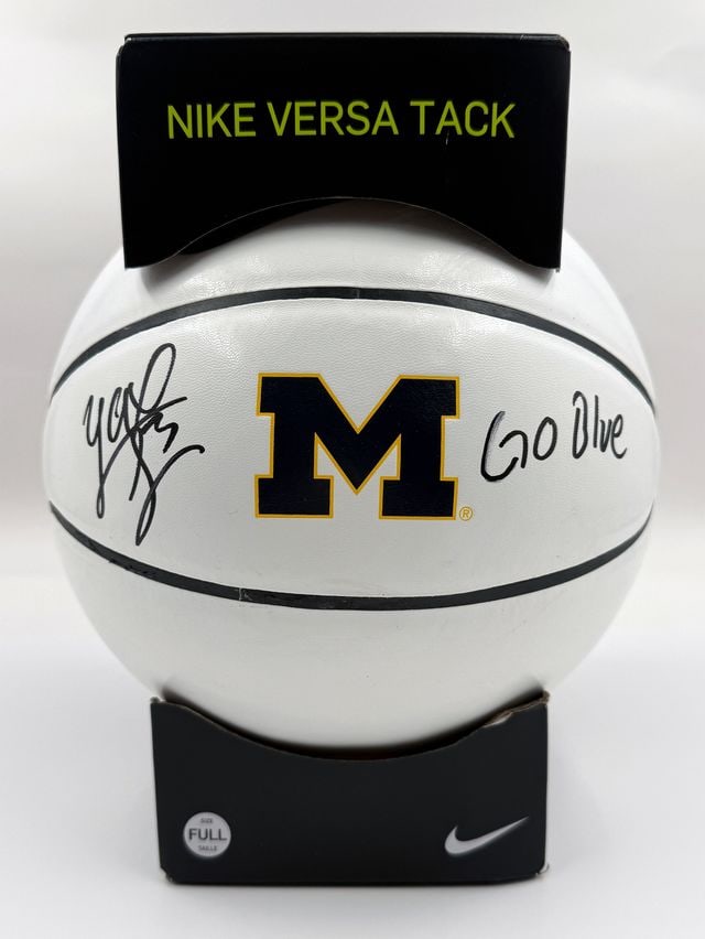 Yaxel Lendeborg Signed Michigan Wolverines Nike Brand Basketball (JSA Authentication): White University of Michigan Wolverines Nike brand basketball signed on either side of the logo in black felt tip marker by basketball player Yaxel Lendeborg, who inscribed "Go Blue" after his