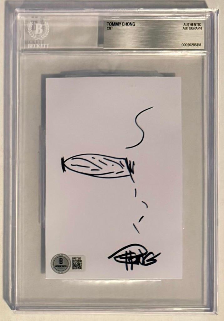 Cheech & Chong: Tommy Chong Signed 4" x 6" Sketch (Beckett Encapsulated): White 4" x 6" sketch signed in black felt tip marker by half of the Cheech & Chong duo Tommy Chong. In fine condition. Encapsulated and authenticated by Beckett (#00020205118).
