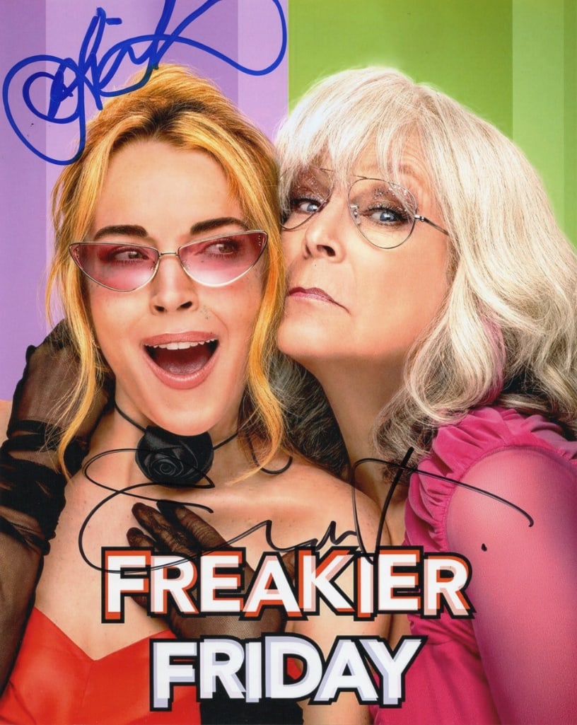 Freakier Friday: Lindsey Lohan & Jamie Lee Curtis Signed 10" x 8" Photo (Third Party Guaranteed): Color 10" x 8" photo from the film "Freakier Friday" signed in blue and black felt tip markers by Lindsey Lohan and Jamie Lee Curtis. In fine condition. Provenance Eaton & Brennan Auctions guarantees