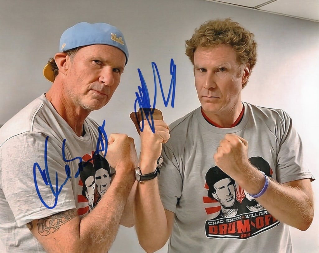 Will Ferrell & Chad Smith Signed 8" x 10" Photo (Third Party Guaranteed): Color 8" x 10" photo signed in blue felt tip marker by actor Will Ferrell and Red Hot Chili Peppers drummer Chad Smith. In fine condition. Provenance Eaton & Brennan Auctions guarantees this lot to