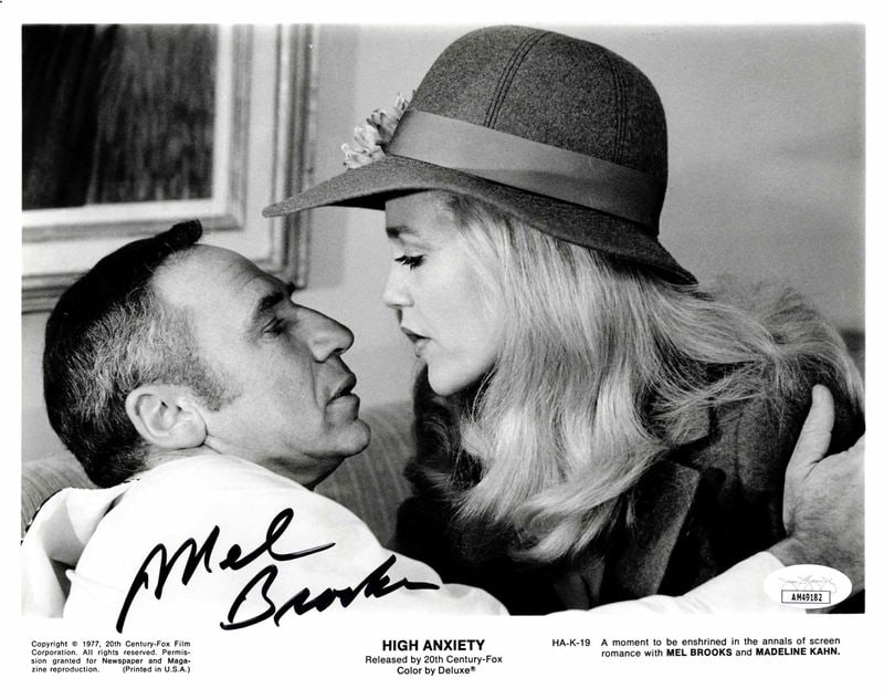 High Anxiety: Mel Brooks Signed 8" x 10" Film Still (JSA Authentication): Black-and-white 8" x 10" film still of the characters Dr. Richard Harpo Thorndyke and Victoria Brisbane from the film "High Anxiety" signed in black felt tip marker by actor and director Mel Brooks.